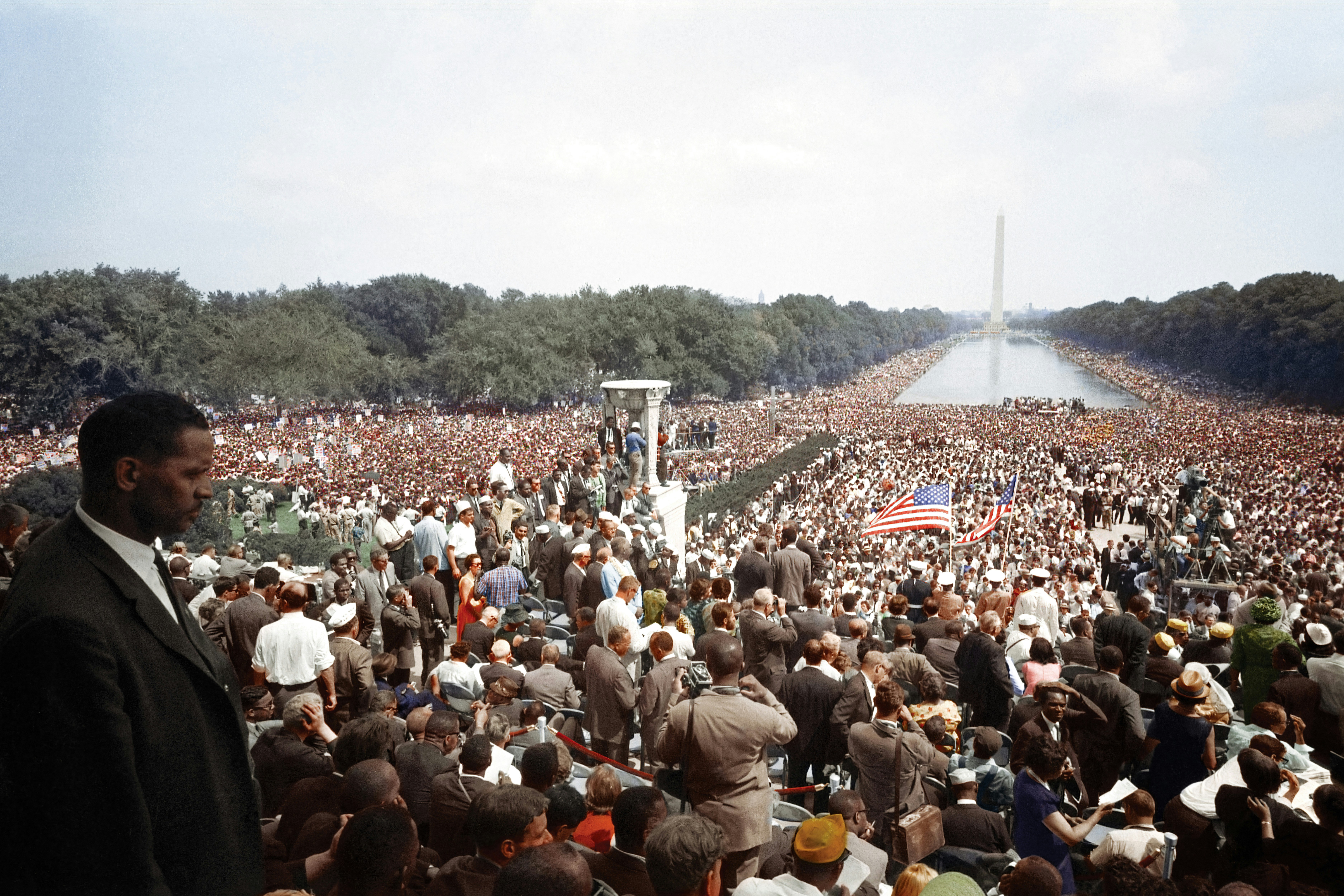Civil Rights demonstrators marching with signs demanding equal rights