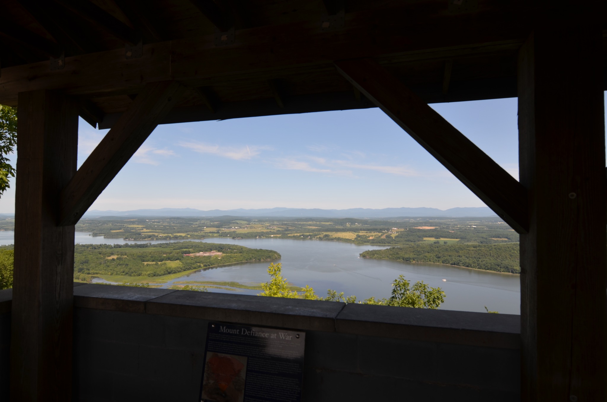Visitors standing at the Mount Defiance overlook above Lake Champlain