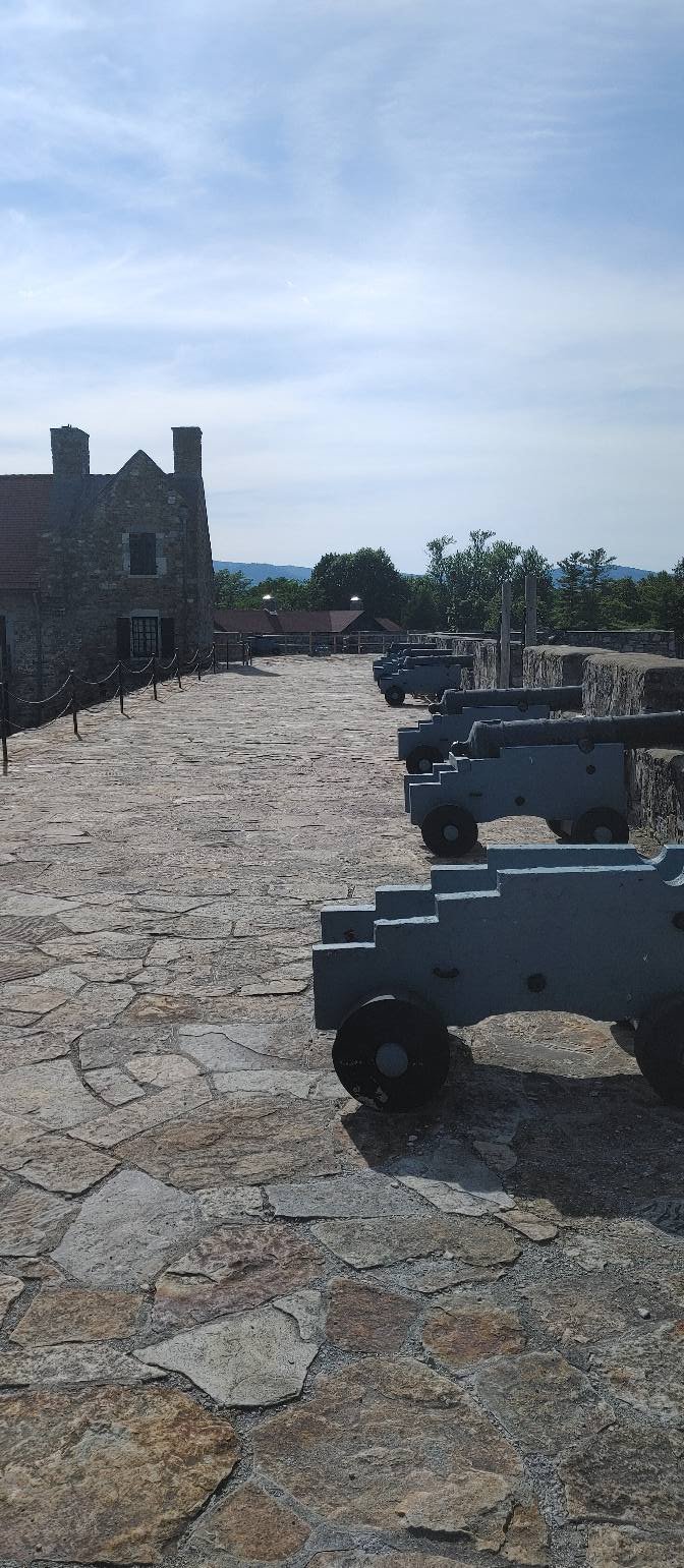 A long line of cannon positioned along the ramparts of Fort Ticonderoga