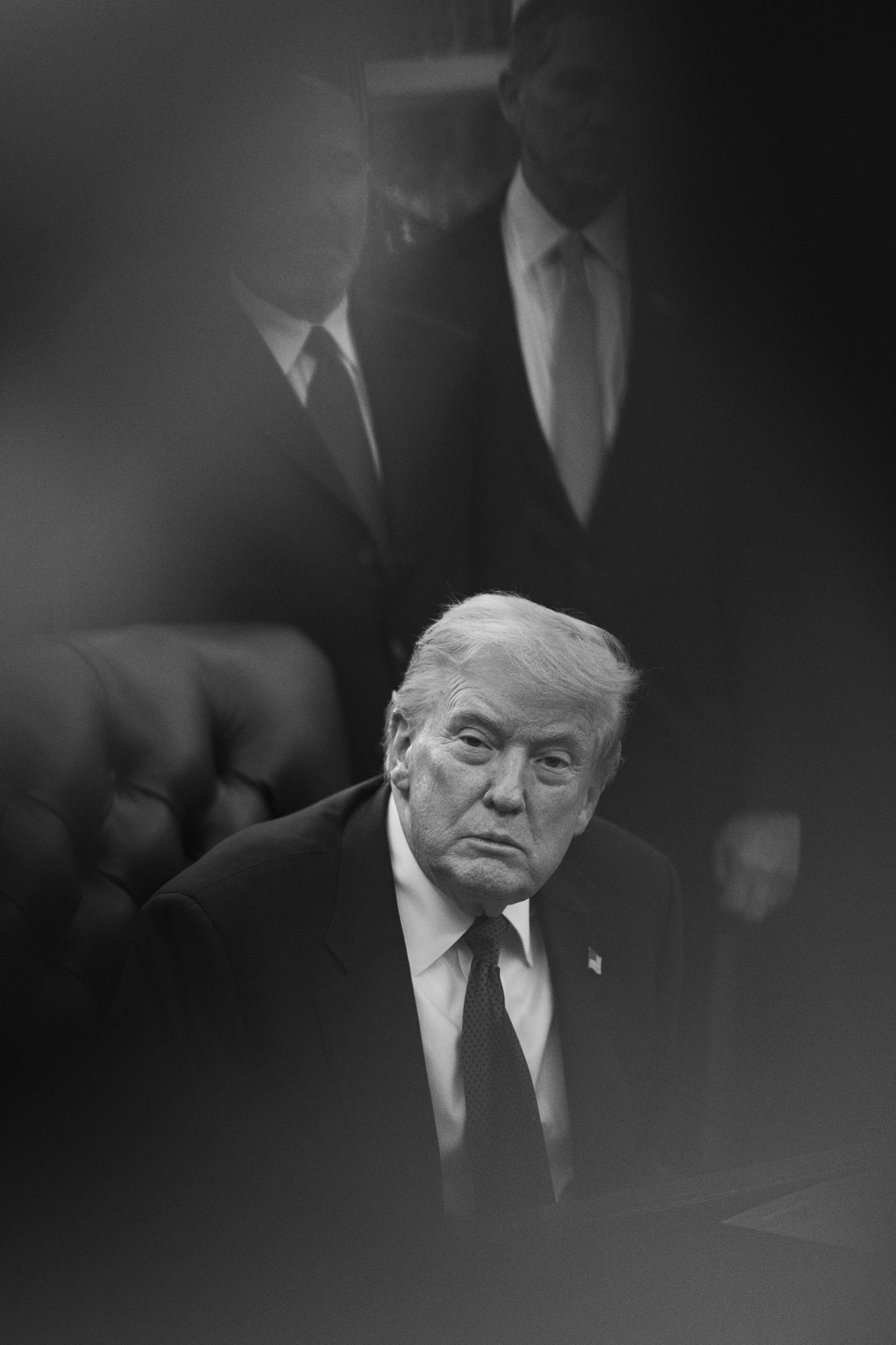 President Donald Trump seated in the White House